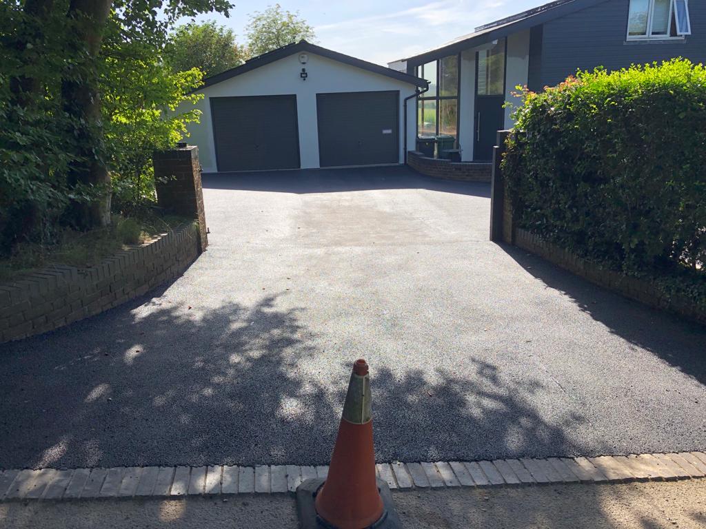 This is a photo of a bitumen driveway which is in the process of being installed by Craigieburn Road Tech